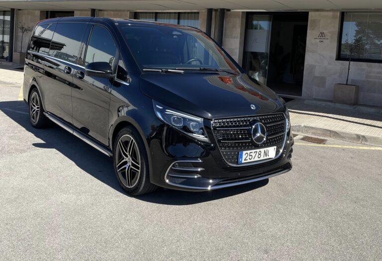 Black Mercedes-Benz V-Class parked outside a building.
