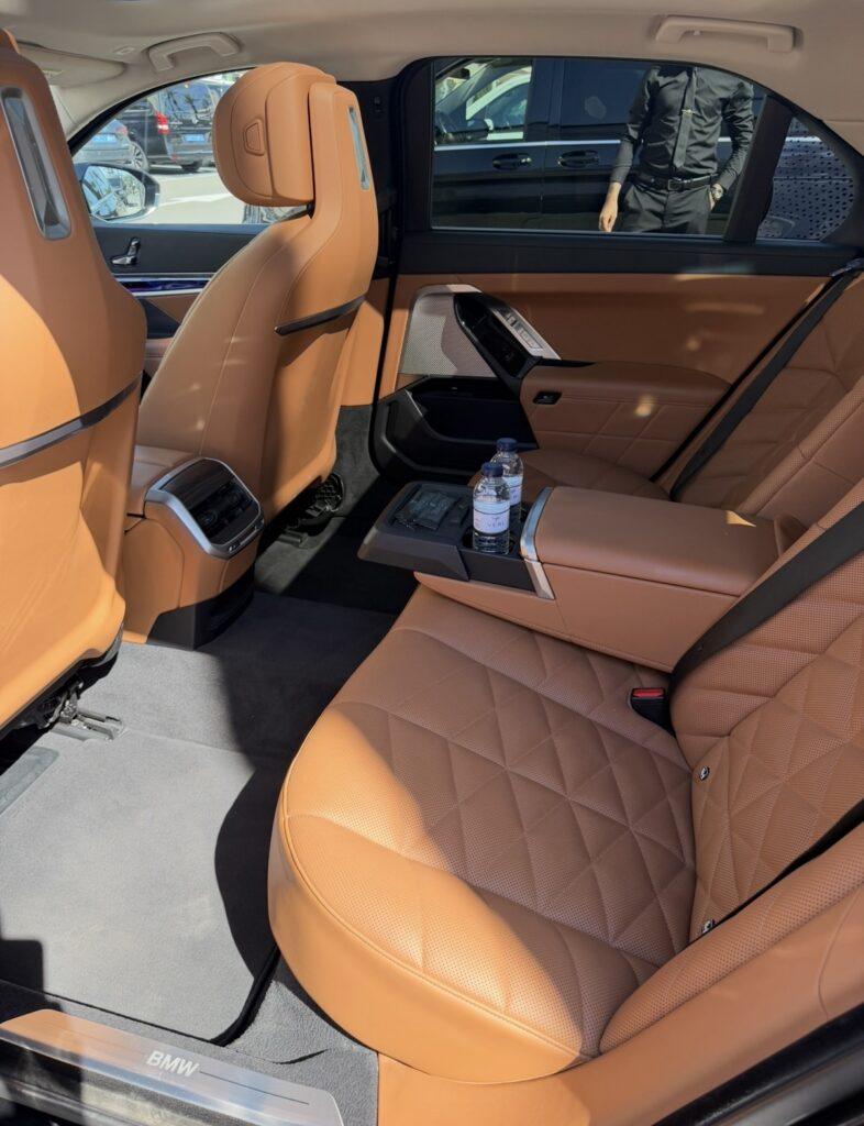 Tan leather rear passenger seats inside a BMW saloon.